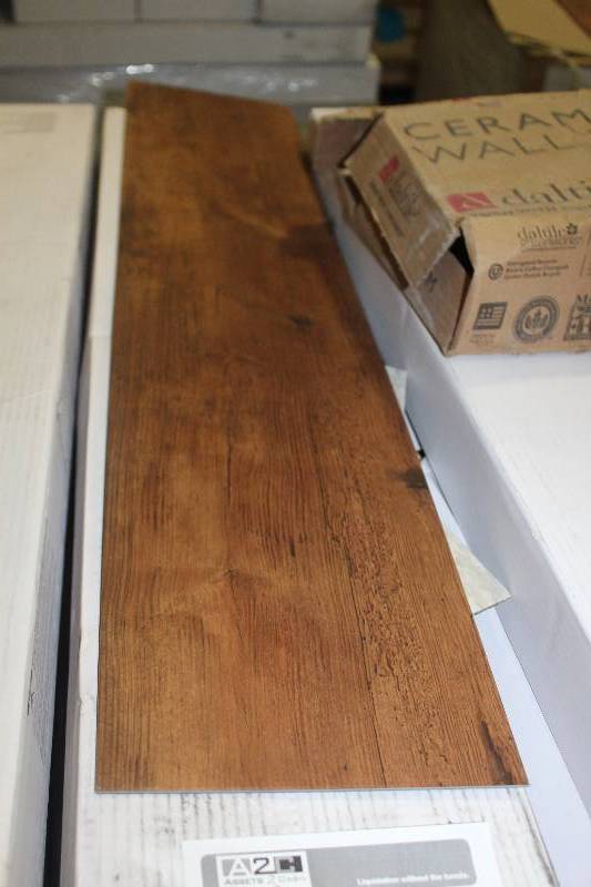 lot 101 image: Pallet Lot of (15) Boxes of Armstrong Commercial Natural Creations 36x8in. Weathered Oak Golden Brown Wood Vinyl Flooring