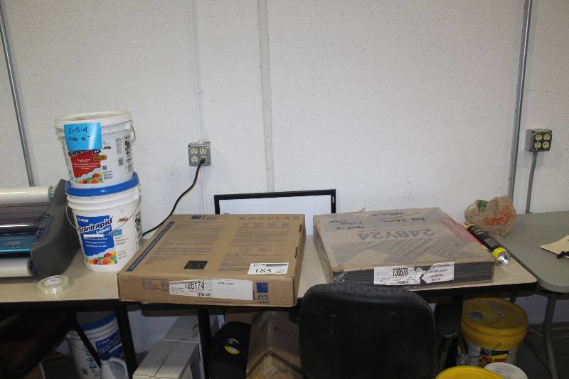 lot 185 image: Pallet Lot of (6) Including 2) Tubes of Carpet Tack Adhesive, 2) Boxes of 24x24in. Carpet Tiles, 1) 3.5-Gallon Bucket of Mapei Mapelastic CI Crack Insulation Membrane, 1) 3.5-Gallon Bucket of Mapei Granirapid Liquid Flexible Admixture