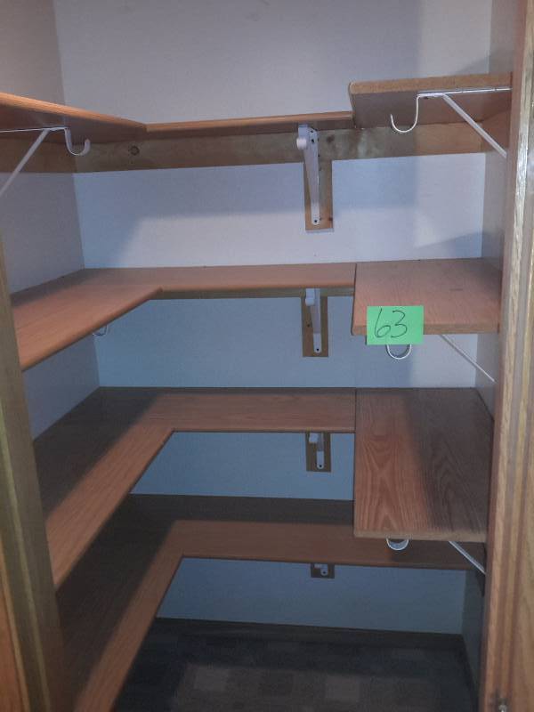 lot 63 image: 4 Shelves in the closet as shown