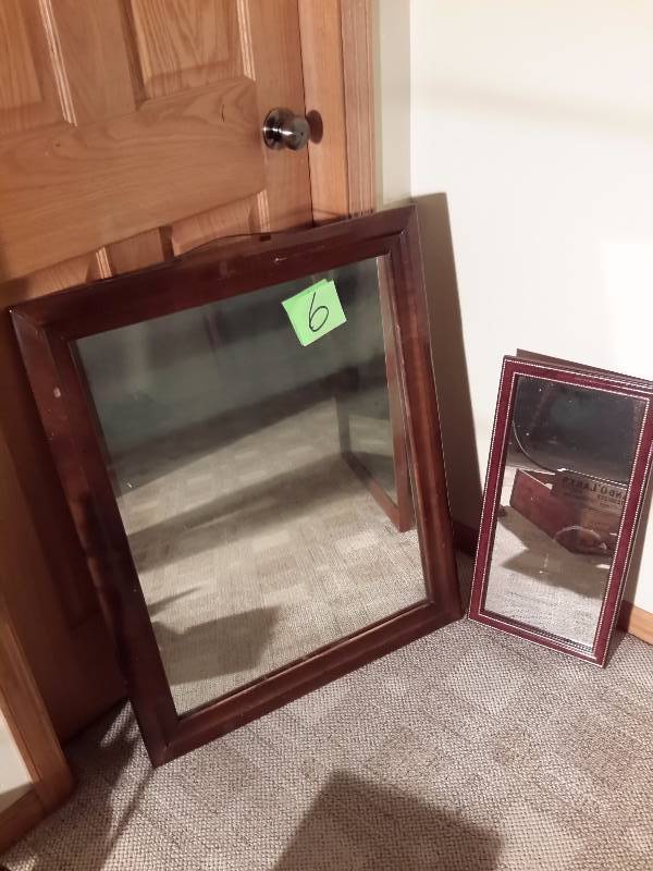lot 6 image: 2 mirrrors with solid wood frames.  Large one has some hazing in the mirror, otherwise good shape.  Please inspect.
