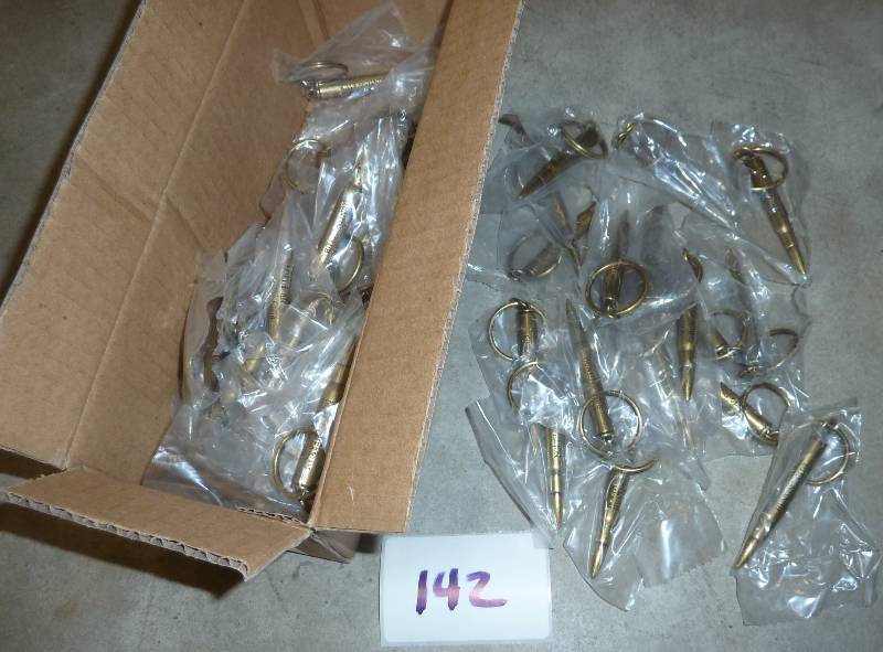 lot 142 image: box of 50 bullet keyrings...