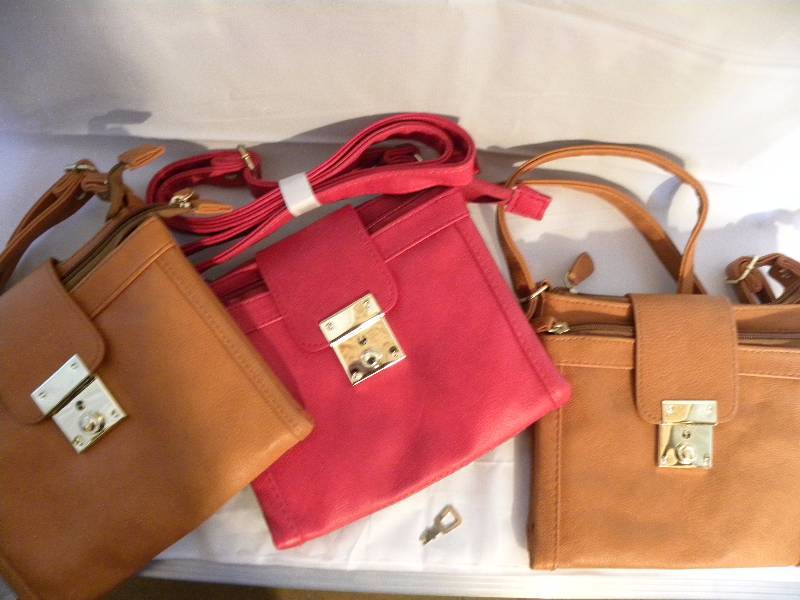 red and tan purses