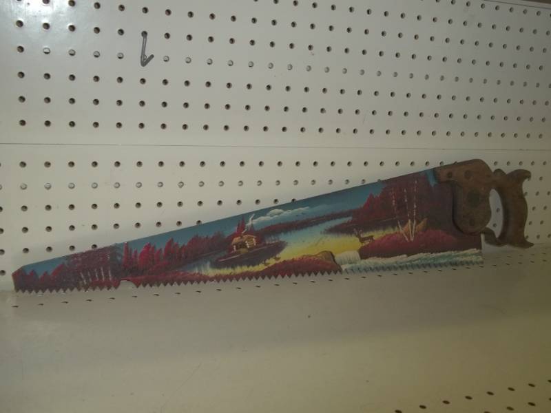 lot 61 image: Painted hand saw