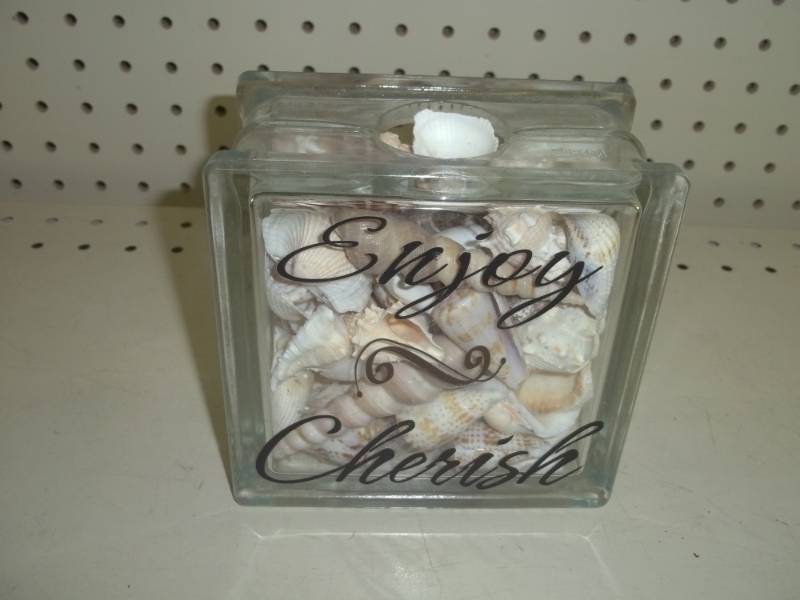 lot 94 image: Glass block with seashells