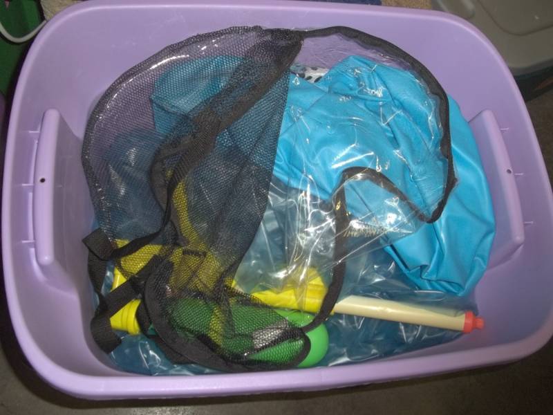 lot 169 image: Tote with Inflatable water toys includes water gun