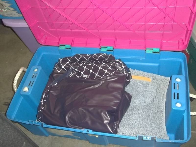lot 178 image: Plastic Foot Locker Tote with air mattress and bathroom rugs