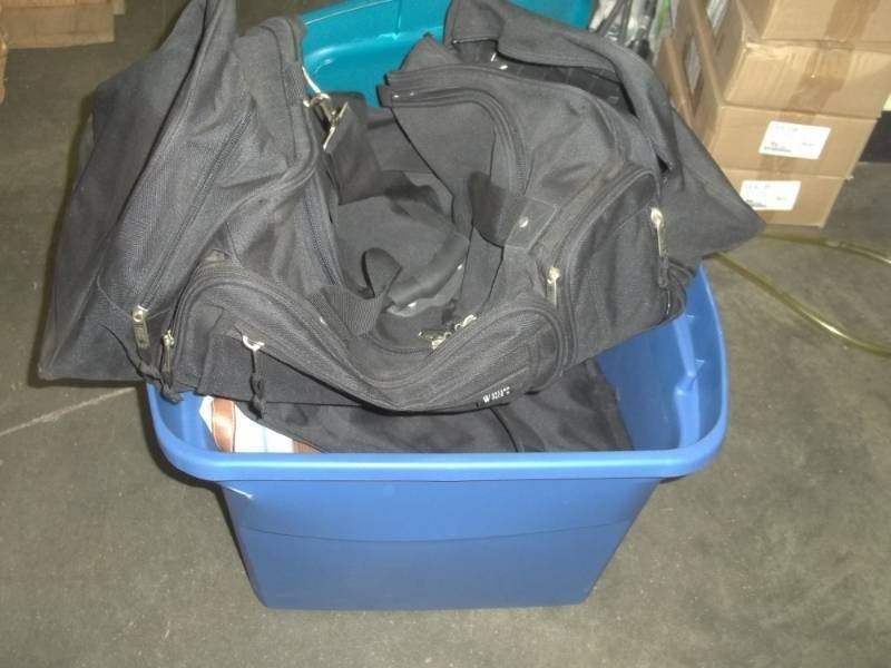 lot 194 image: Storage Tote with duffle bags