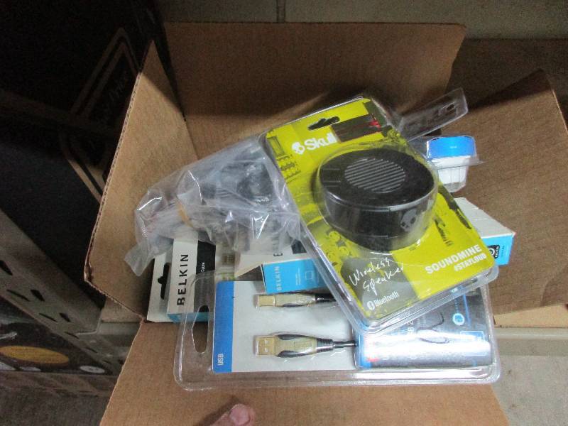 assorted computer cords and Scullcandy speaker