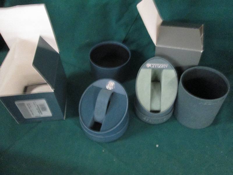 box full of watch cases from citize...