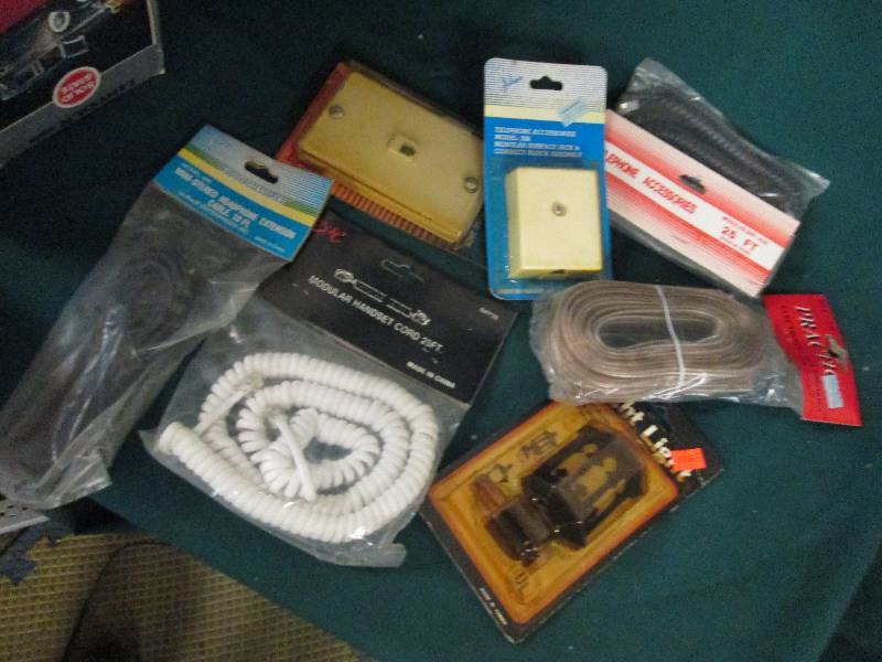 box of phone cords , phone wall jac...