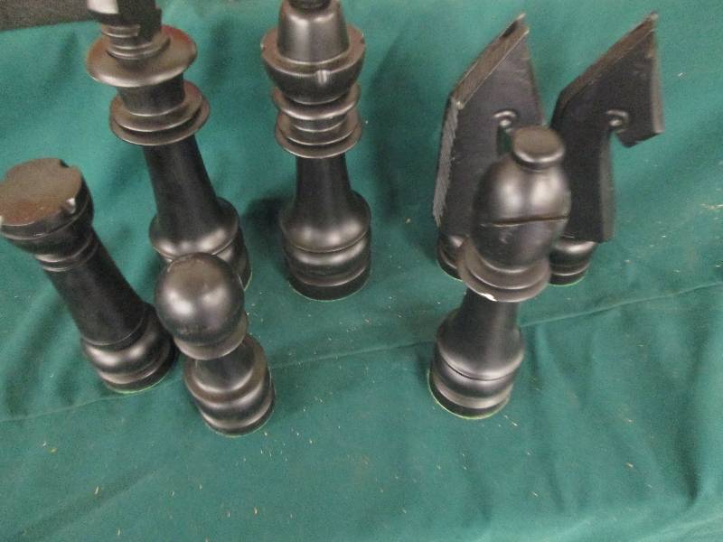 7 big black chess piecces ...