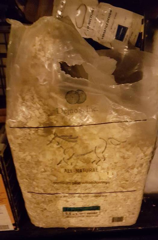 lot 33 image: Used bag of wood chips for animal bedding