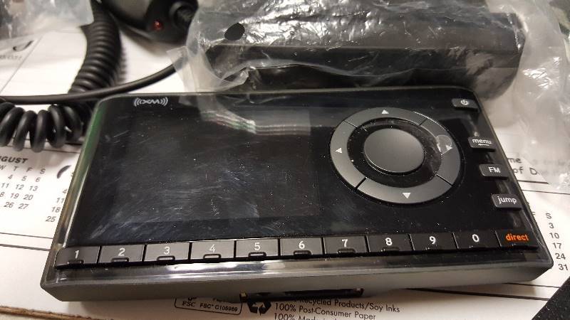 lot 38 image: Lot of ear piece and Sirius machine