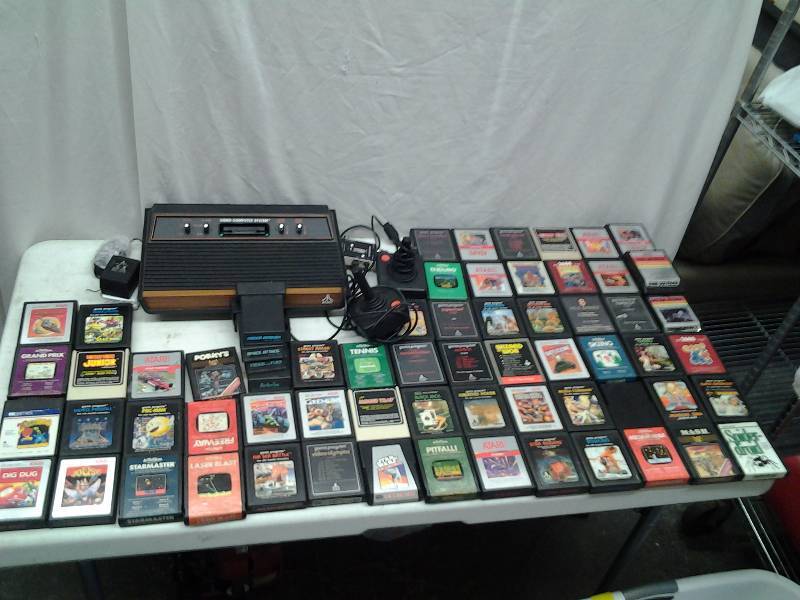 lot 19 image: Vintage Atari Game Console With Remote & Large Variety Of Games