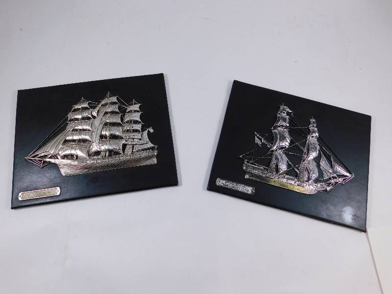 lot 52 image: Lot of 2 Metal Ships Mounted on Leather Plaques