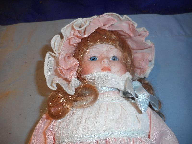 lot 35 image: HAND PAINTED PORCELAIN DOLL