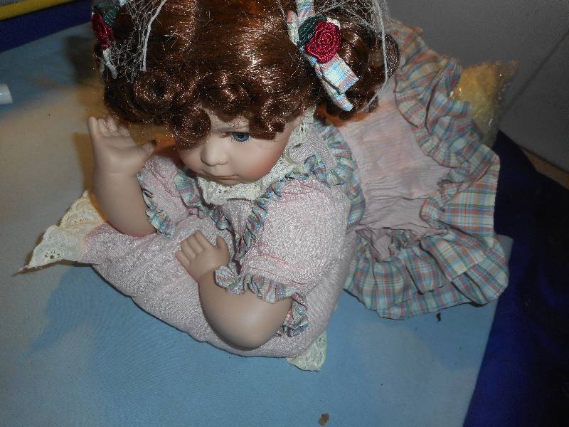 lot 39 image: BABY BRIGHT PORCELAIN DOLL