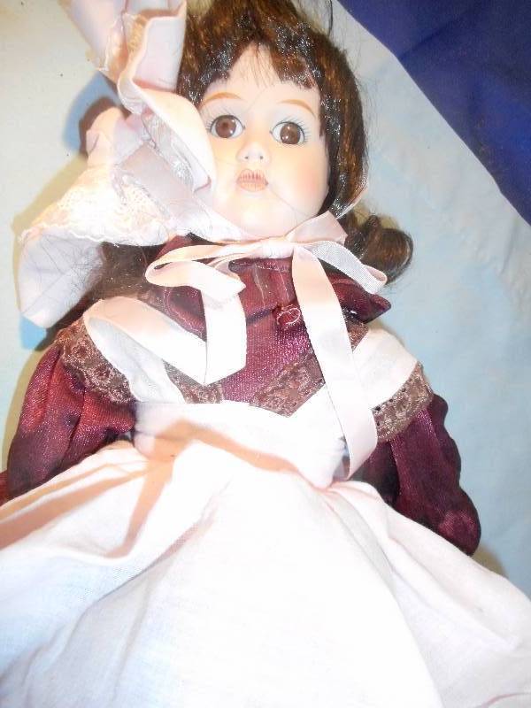 lot 41 image: 17 INCH PORCELAIN DOLL