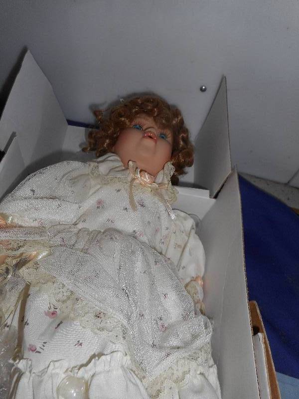 lot 73 image: BUBBLE BLOWING PORCELAIN DOLL