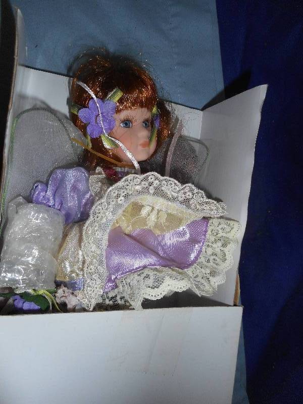 lot 76 image: JOELLE POECELAIN DOLL