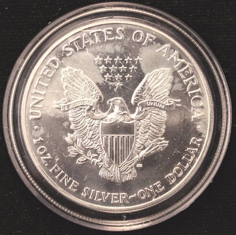 lot 24 image: 1999 COLORIZED AMERICAN SILVER EAGLE 1 TROY Oz. .999 FINE SILVER DOLLAR IN AIRTITE HOLDER