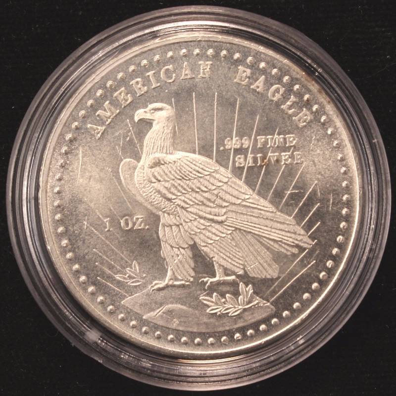 lot 59 image: 1 TROY OZ. .999 FINE SILVER ROUND VINTAGE EAGLE REVERSE IN AIRTITE HOLDER