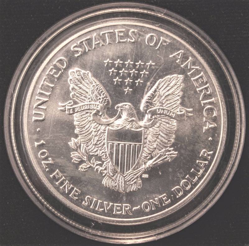 lot 81 image: 1999 COLORIZED AMERICAN SILVER EAGLE 1 TROY Oz. .999 FINE SILVER DOLLAR IN AIRTITE HOLDER