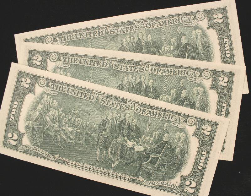 lot 34 image: GROUP OF 3 CRISP UNC. US $2 BILLS WITH STAMP & CONSECUTIVE SERIAL #S