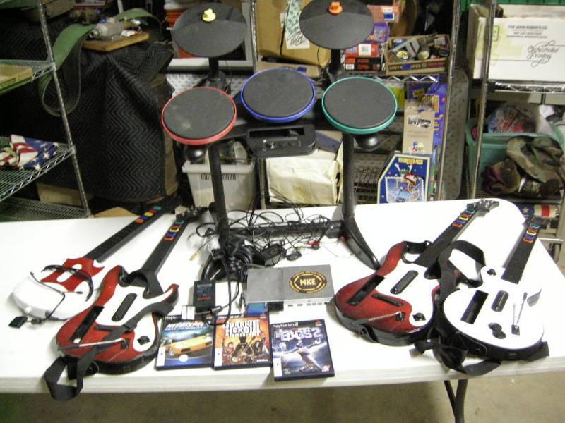 lot 84 image: PS2 Guitars, Games, Drumset