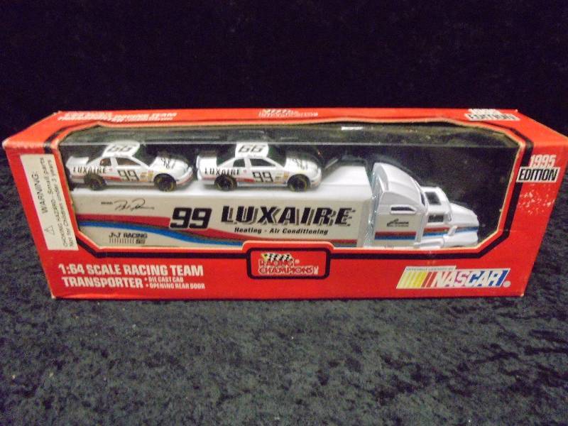 lot 51 image: Racing Champions 164 Race Team Transporter, #99 Luxaire