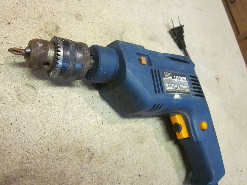 Rigid Tool Bag, Electric Drill, and Hand Saw