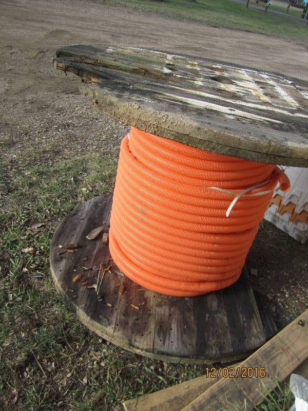 Spool of corrugated plastic tubing,...