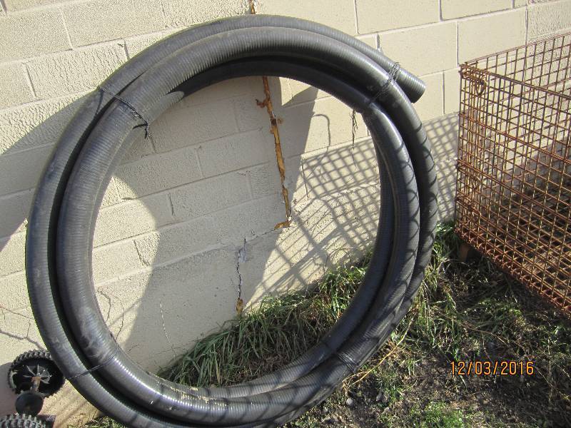 Roll of black plastic tube, just ov...