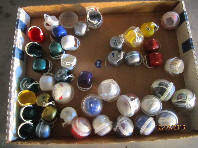 Lot of sports team helmet toys...