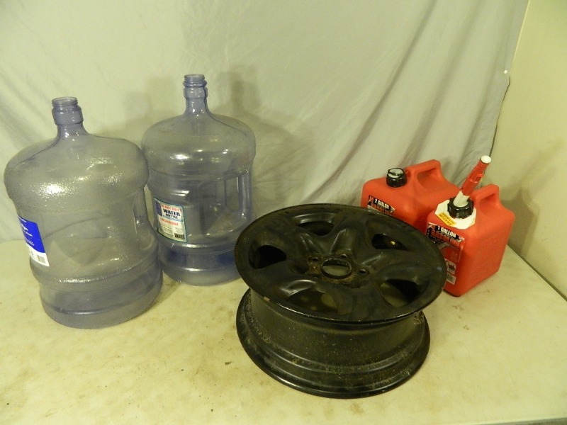 lot 193 image: Steel Wheel, Gas Cans, and More