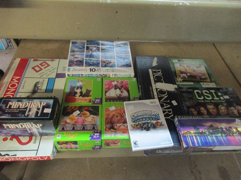 lot 26 image: box of kids puzzles and games