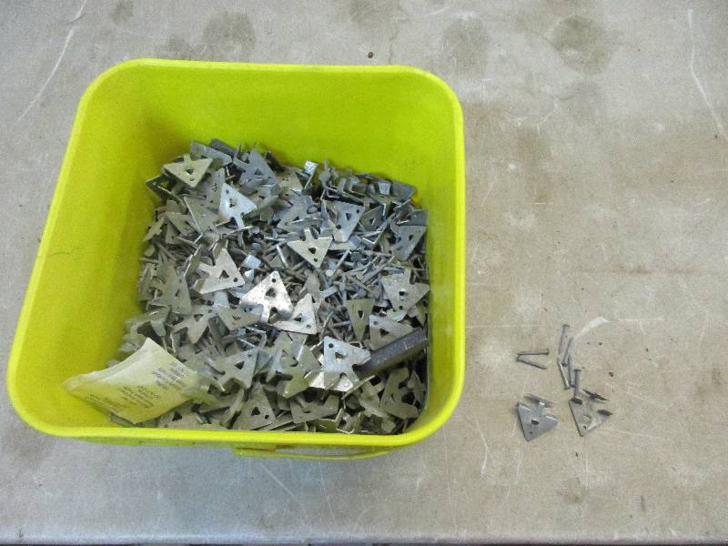 lot 91 image: bucket of nails and carpenter cleats