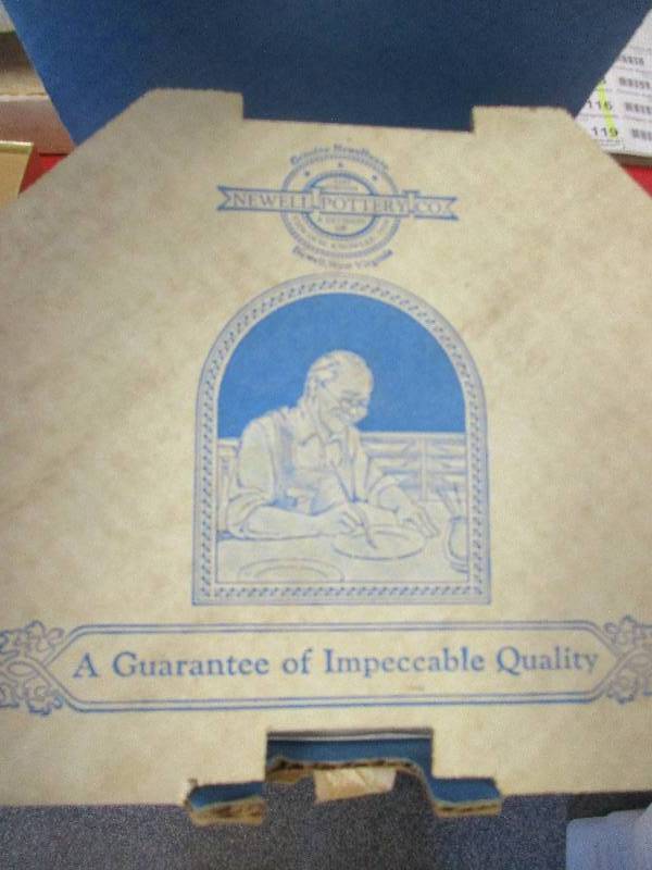 lot 108 image: Newell pottery company - 9 collector plates and plate world books