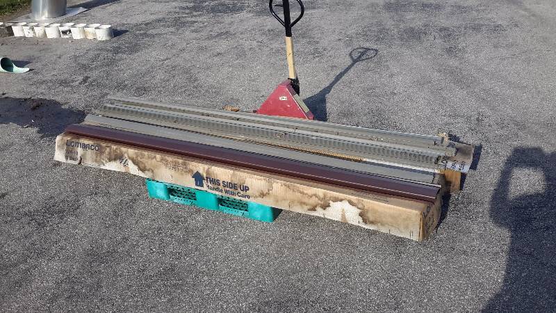 lot 3 image: 2 cases of siding along with several trim pieces