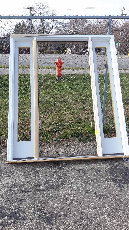 lot 9 image: Residential doorframe with window cutouts on each side