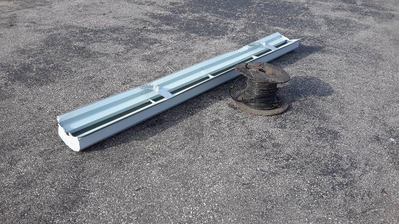 lot 10 image: Spool of telephone cable and metal light cover shield