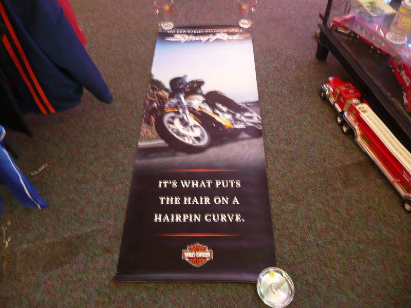lot 31 image: Harley Davidson Dealer Banner - Original - Featuring VRSCR Street Rod Bike - 24 by 70 - Excellent Condition