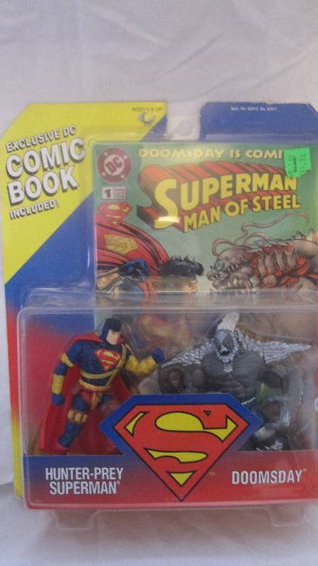 lot 63 image: 1995 Superman vs Doomsday action figures with comic book