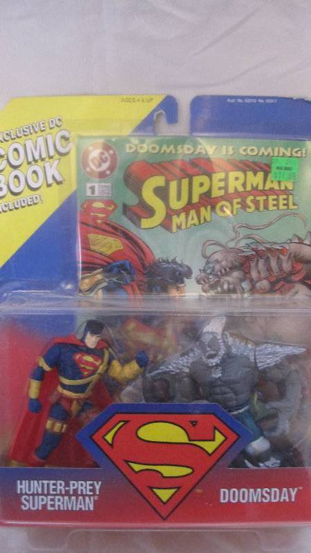 lot 64 image: 1995 Superman vs Doomsday action figures with comic book