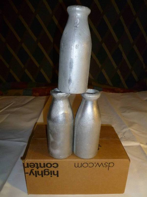 lot 144 image: Carnival Aluminum Milk Bottles