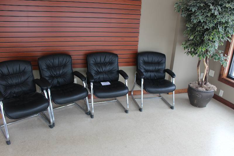 Lot of (5) Furniture Includes 4) Black Padded Chairs AND 1) Decorative Plant