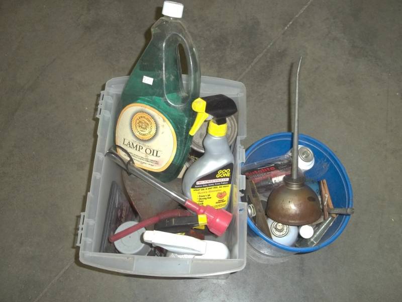 lot 69 image: Lamp oil, cleaning supply, gas funnel, oil cans, etc.