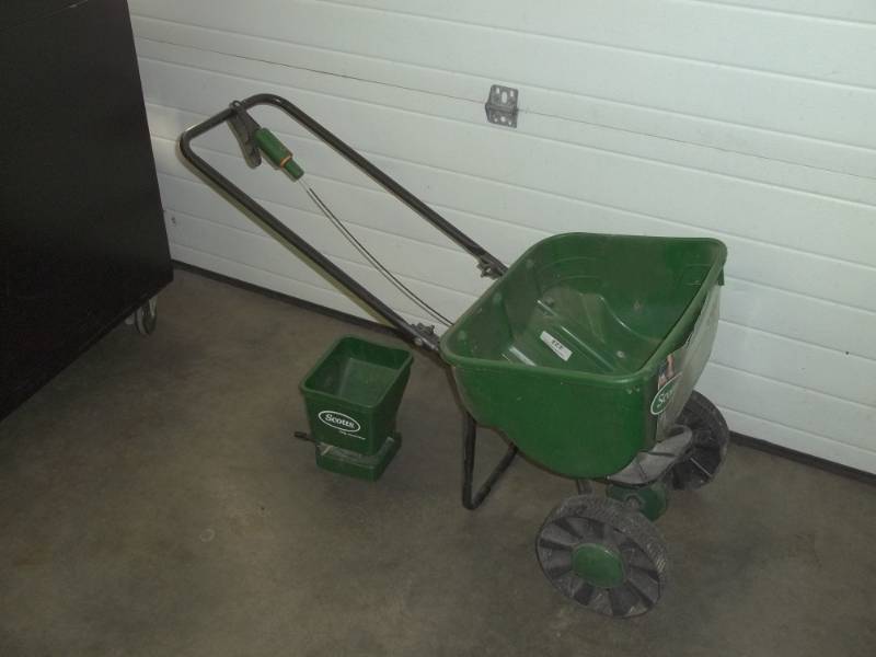 lot 93 image: Scotts fertilizer spreader and a grass seeder