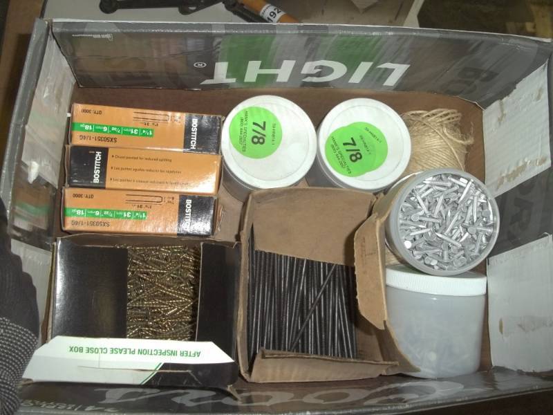 lot 193 image: Box of nails, screws, staple, includes pole barn nails, bosch staples