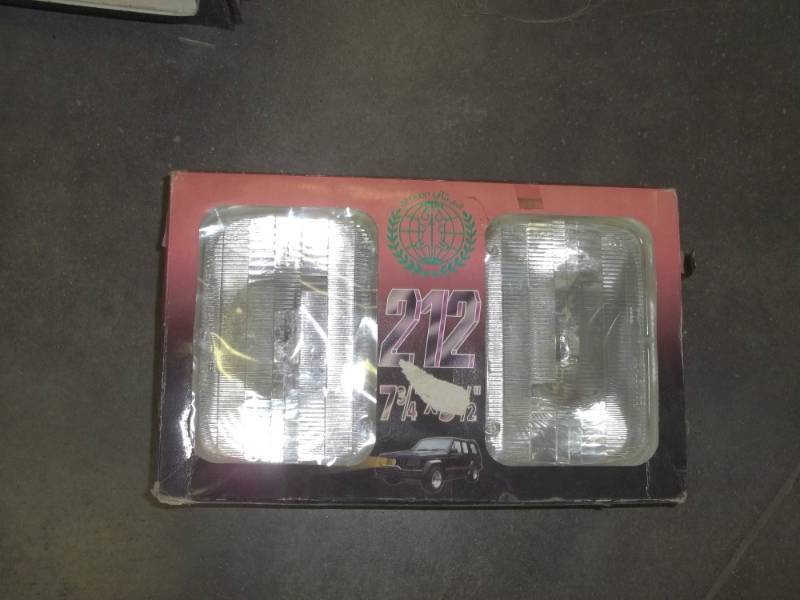 lot 195 image: Pair of 7  12  x  5  34 universal headlights
